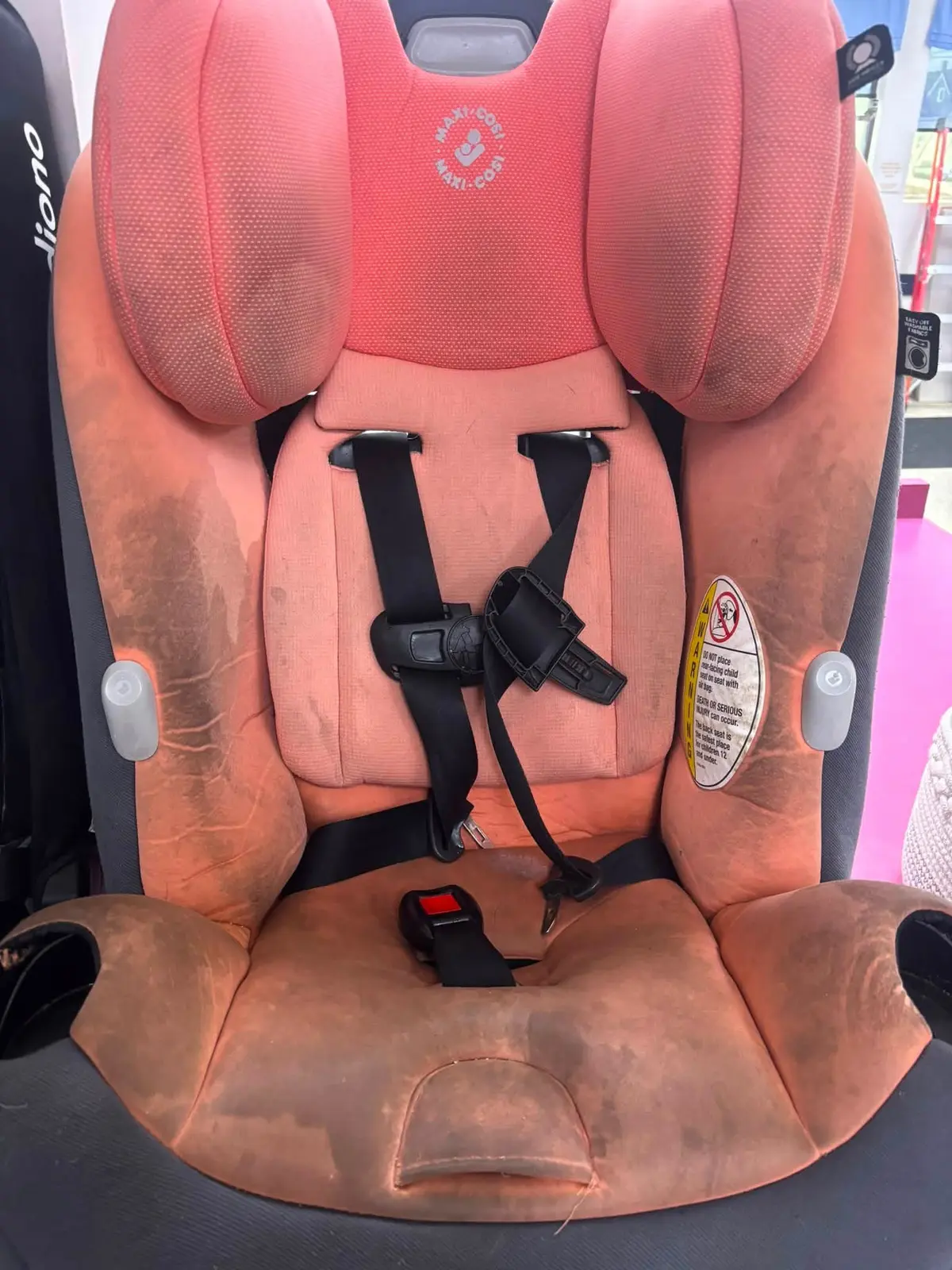 Coral car seat before cleaning