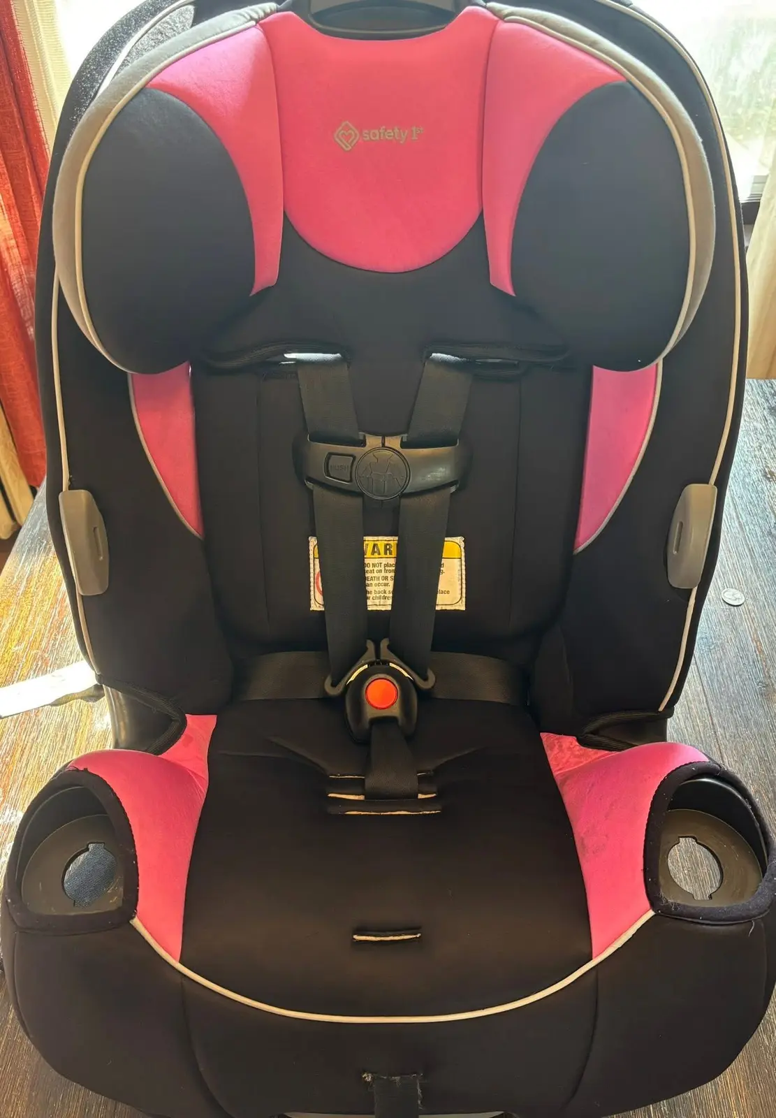 Pink and black car seat after cleaning